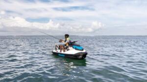 Man fishing with a Sea-Doo FishPro Scout
