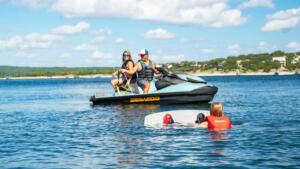 Family prepping a wakeboard ride with the Sea-Doo Wake